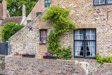 Restored medieval house in the historic center of Brugge in Flanders Belgiumの写真素材