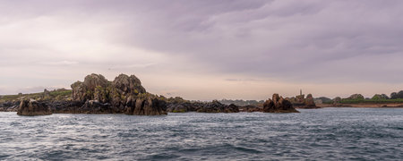 Scenic view of the rocks surrounding little island Ile-de-Brehat at the coast of Cotes-dArmor in Brittany in Franceの写真素材