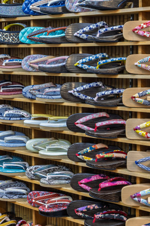 Collection of traditional zori and geta sandals in a store in Tokyo in Japanの写真素材