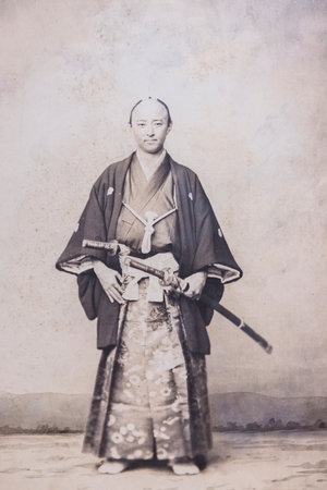 Tokyo, Japan- March 16, 2025: Vintage photo of Japanse Samurai with sword from the 19th century in National museum in Tokyo Japanの写真素材