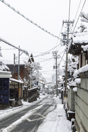 Townscape of town Yudanaka during wintertime in the snow, Nagano region in Japan.の写真素材
