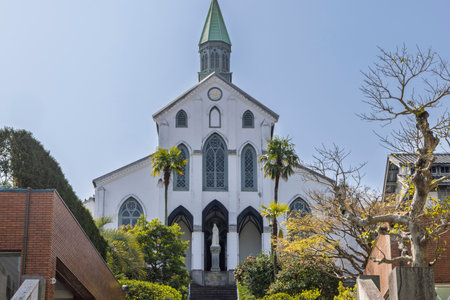 Oura Cathedral at entrance of Glover garden and park in Minamiyamate hillside overlooking Nagasaki harbor in Nagasaki in Japanの写真素材