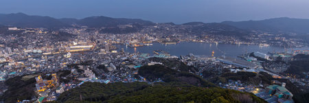 Impressive panoramic view durign the evening from the observation deck at the summit of Mount Inasa in Nagasaki in Japanの写真素材