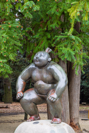 Kyoto, Japan - March 27,2025: Sculpture of sumo wrestler in Kyoto Botanical garden and park in Kyoto, Japanのeditorial素材