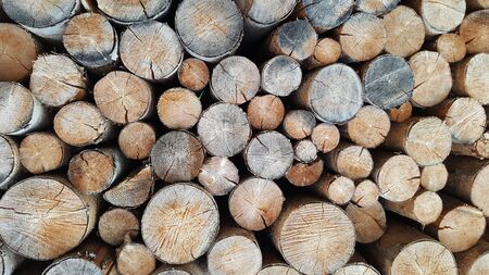a pile of chopped log ready to be used at the fire place in winter at Austriaの写真素材