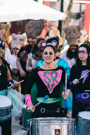 Fuengirola, Spain; Feb, 22, 2020; woman dressed as a hero playing the drum prepared for the carnival...