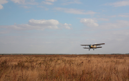The old plane against the cloudy skyの写真素材