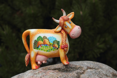 Plaster figure of a cow of the summer village decorated with the image.の写真素材
