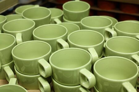 It is a lot of green ceramic cups offered for sale.の写真素材