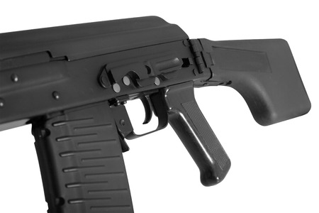 Weapon - A close up black Assault rifle on a white background. It is isolated, the worker of paths...