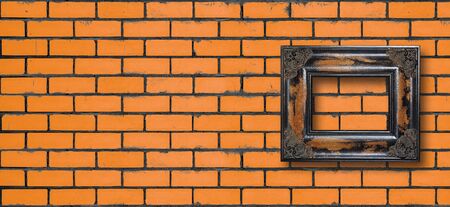 Wall in an interior - Vintage frame in a yellow brick wall texture backgroundの写真素材