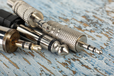 Audio and music - jack audio and guitar set on a vintage wooden background.の写真素材