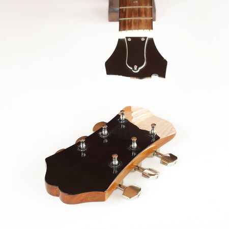 Guitar repair and service - Broken Headstock acoustic guitar white backgroundの写真素材