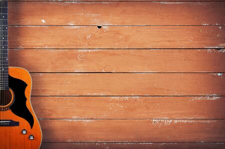 Musical instrument - Classic acoustic guitar on a wooden background.の写真素材
