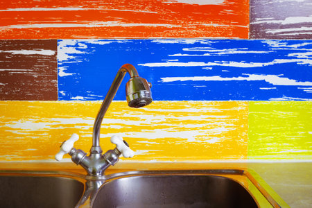 Plumbing and sewerage - Kitchen water tap faucet on a motley backgroundの写真素材