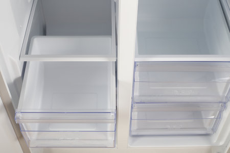 Home appliance - Inside closeup open two-door white refrigerator freeze and fresh zoneの写真素材