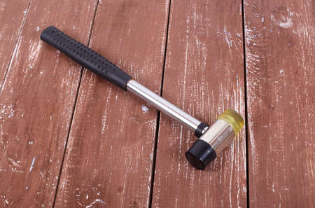 Guitar repair tools - Fret Hammer on a wooden background.の写真素材