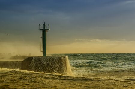 THE STORM AT SEA - Waves crashing on the falochromの写真素材