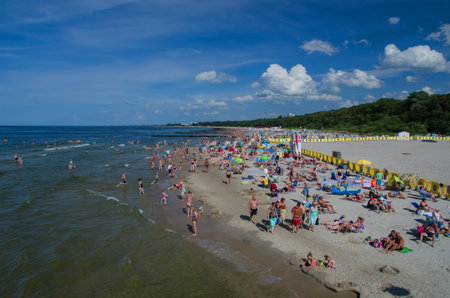 KOLOBRZEG - Tourists lounging on a sunny beach in Kolobrzegのeditorial素材