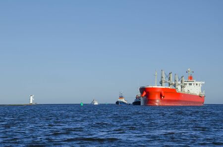 SHIP AND Tugs - Large ship entering the port of Swinoujscie