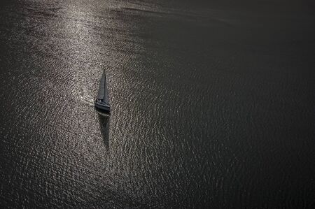SAILING - Top view of the flowing sailboatの写真素材