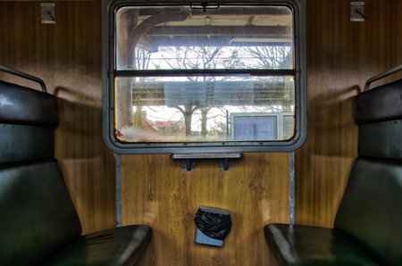 IN THE OLD TRAIN. Passenger train from Kolobrzeg to Poznan. The interior of the car in the old...