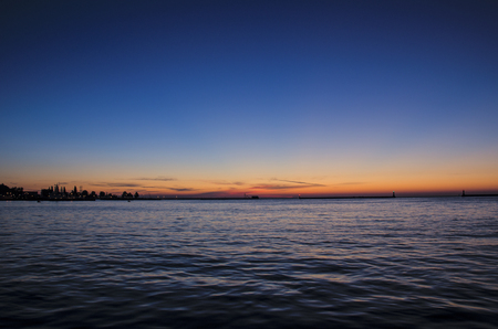 SUNRISE OVER THE SEA. Sunny dawn in the port of Gdyniaの写真素材