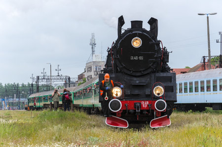 LOCOMOTIVE IN STATION RAILWAY
