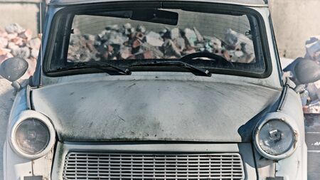 OLD CAR - A wreck of a vehicle on a scrap yardの写真素材