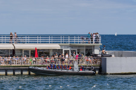KOLOBRZEG, WEST POMERANIAN / POLAND - 2017: Holidaymakers at cafeteria tablesのeditorial素材