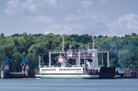 SWINOUJSCIE, WEST POMERANIAN / POLAND: Ferry crossing for cars on the road to the city