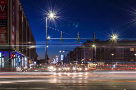 KOSZALIN, WEST POMERANIAN / POLAND: Christmas time - Evening traffic at the intersection of streetsのeditorial素材