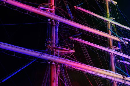 SAILING SHIP - Masts of a sailing ship in the night illuminationの写真素材