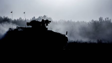 INFANTRY FIGHTING VEHICLE - A military vehicle in the sun and in the dust