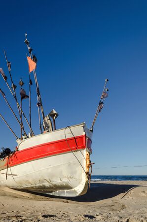FISHING - Fishing boat on the sea shoreの写真素材