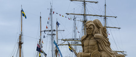 SZCZECIN, WEST POMERANIAN / POLAND: Tall Ships Races - Sand sculpture of sea monsters in the marinaのeditorial素材