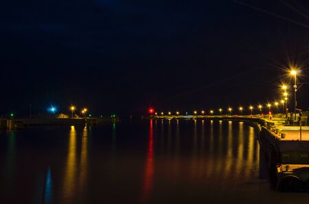 SEAPORT - Night and harbor lights on the breakwatersの写真素材