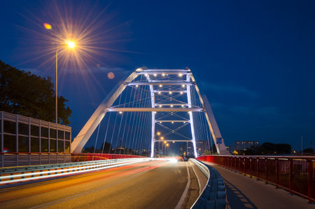 KOLOBRZEG, WEST POMERANIAN / POLAND - 2015: Harbor bridge in the night illuminationのeditorial素材