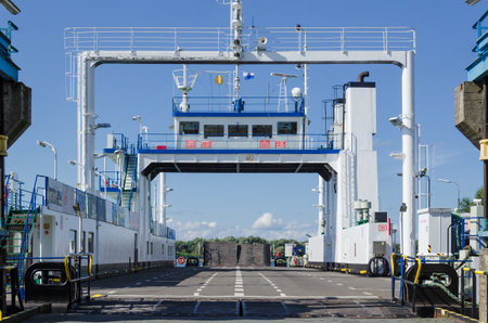 SWINOUJSCIE, WEST POMERANIAN / POLAND - 2017: Car ferry at the waterfront at the crossing into townのeditorial素材