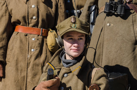 KOLOBRZEG, WEST POMERANIAN / POLAND - 2018: Reconstruction of battle for Kolobrzeg - Soldier radio operator of the Polish Armyのeditorial素材