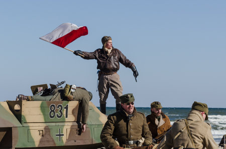 KOLOBRZEG, WEST POMERANIAN / POLAND - 2018: Staging of battle for Kolobrzeg - A Polish soldier with...