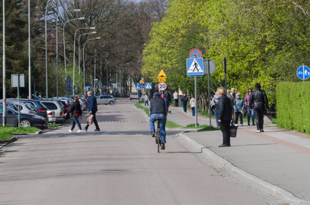 KOLOBRZEG, WEST POMERANIAN / POLNAD - 2018: Spring in the city - People are walking around the city streetのeditorial素材