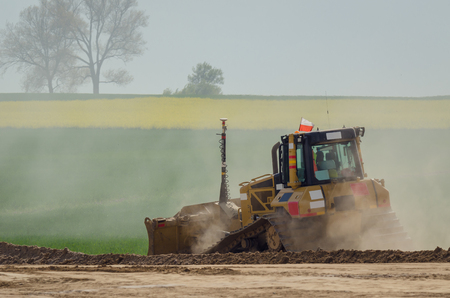 BULLDOZEER - The vehicle at work on construction siteの写真素材