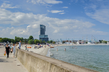 GDYNIA / POLAND - 2015: Residents of the city and tourists are strolling along the seaside promenadeのeditorial素材