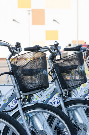 KOLOBRZEG, WEST POMERANIAN / POLAND - 2018: City bikes in the dock are waiting for usersのeditorial素材