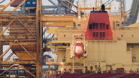 GENERAL CARGO SHIP - Transhipment of a freighter at the quay in Swinoujscieの写真素材