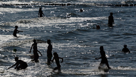 KOLOBRZEG, WEST POMERANIAN / POLAND - 2018: Holidaymakers on vacation by the seaのeditorial素材
