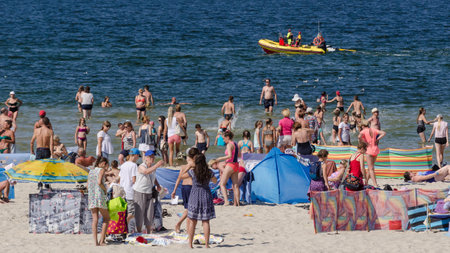 KOLOBRZEG, WEST POMERANIAN / POLAND - 2018: Holiday - Recreation on a sea beachのeditorial素材