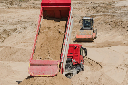 TIPPER TRUCK AND ROAD ROLLER - Vehicles on the construction siteの写真素材
