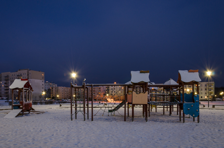 WINTER IN CITY - Snow-covered playground for children in Kolobrzegの写真素材